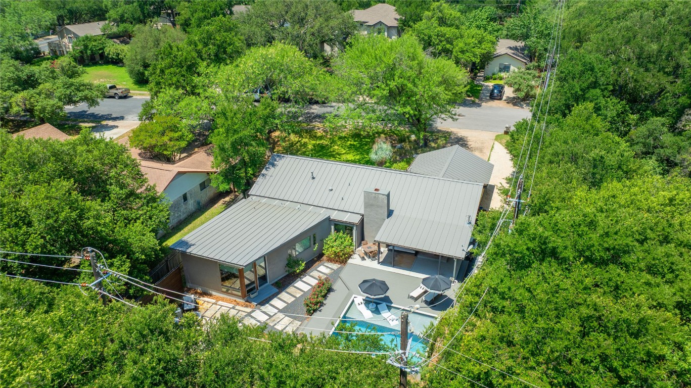 1407 Spring Garden Road Austin, TX 78746 - Photo 27 of 28 an aerial view of a house with swimming pool and garden