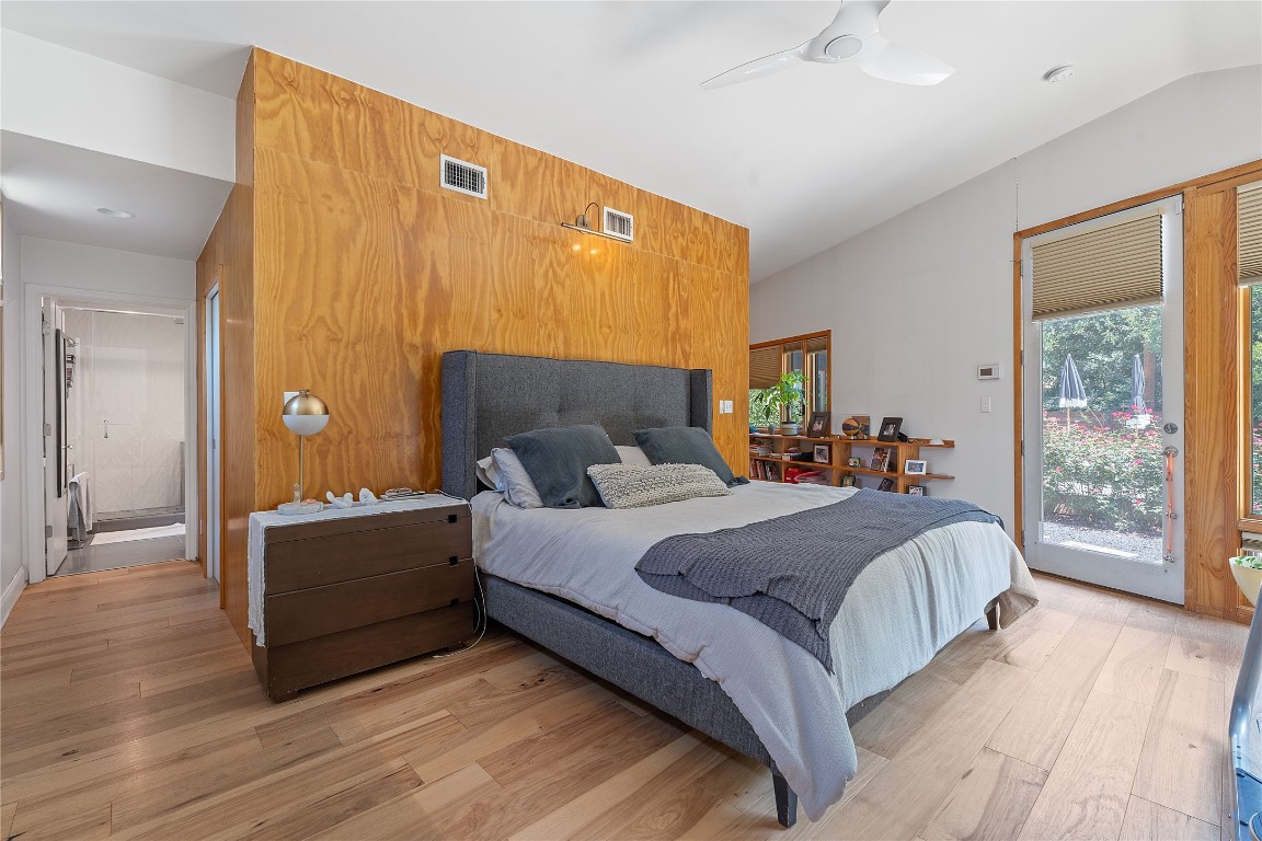 1407 Spring Garden Road Austin, TX 78746 - Photo 5 of 28 a bed room with a bed and a window