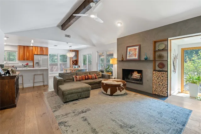 a living room with furniture and a fireplace