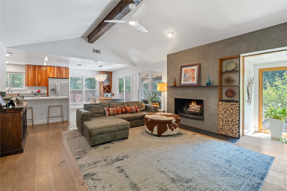 1407 Spring Garden Road Austin, TX 78746 - Photo 7 of 28 a living room with furniture and a fireplace