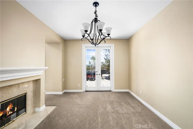 an empty room with a window and wooden floor