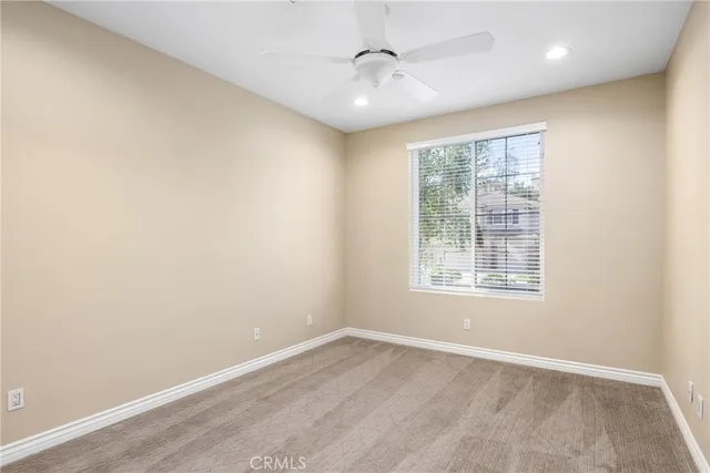a bathroom with a sink a toilet a mirror and vanity