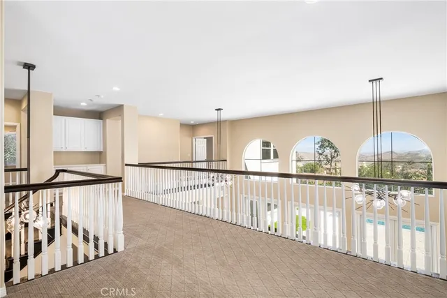 a view of a hallway with staircase