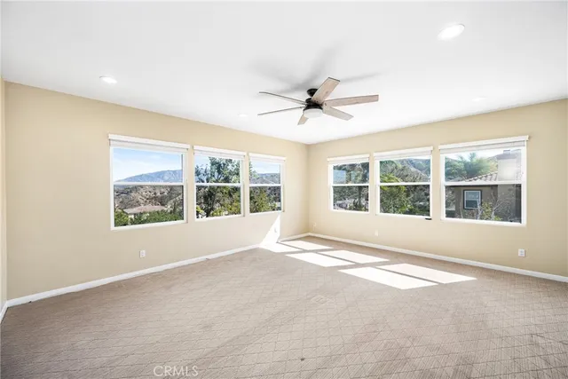 a spacious bathroom with a tub sink and mirror