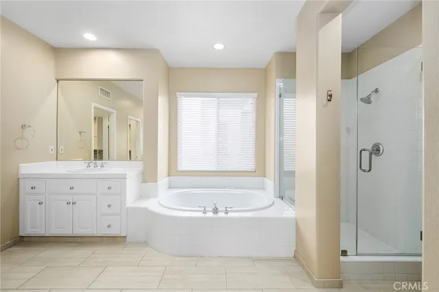 a large bathroom with a tub sink shower double vanity