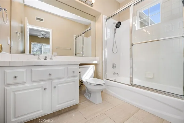 a view of swimming pool with outdoor seating and plants