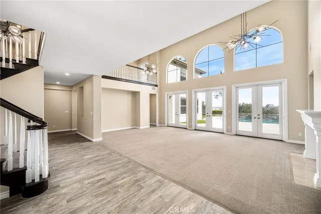 a view of an front door and wooden floor