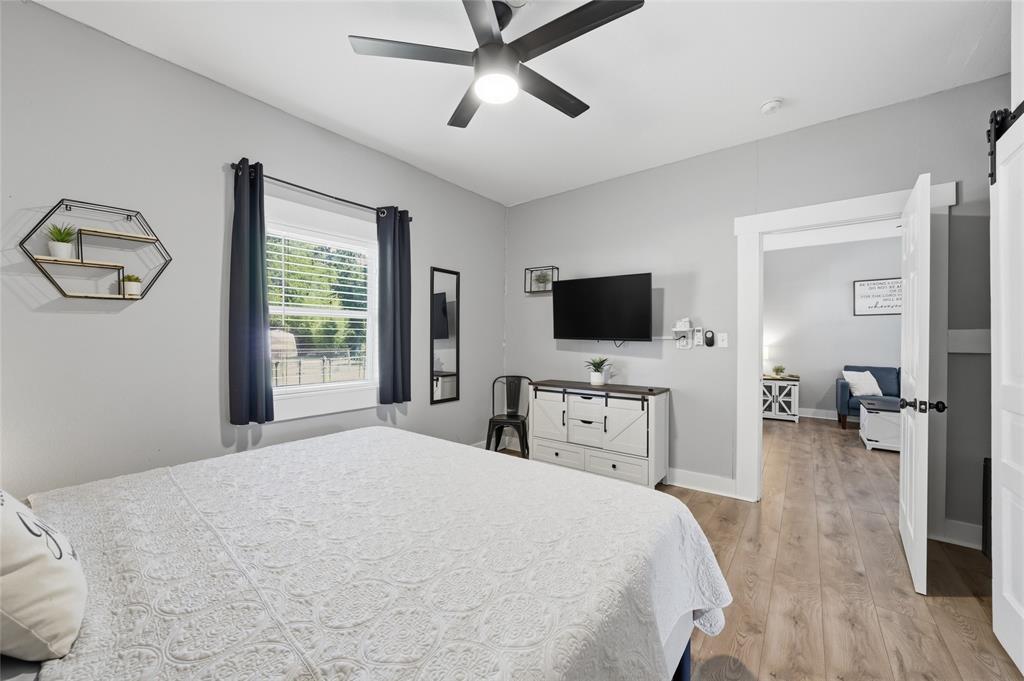 2320 Mistletoe Street Waco, TX 76706 - Photo 11 of 23 a bedroom with a bed and a flat screen tv