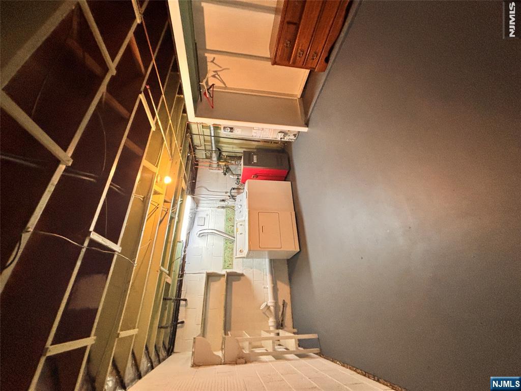 21 Wanamaker Avenue, Unit 1 Waldwick, NJ 07463 - Photo 12 of 13 a storage room with utility racks