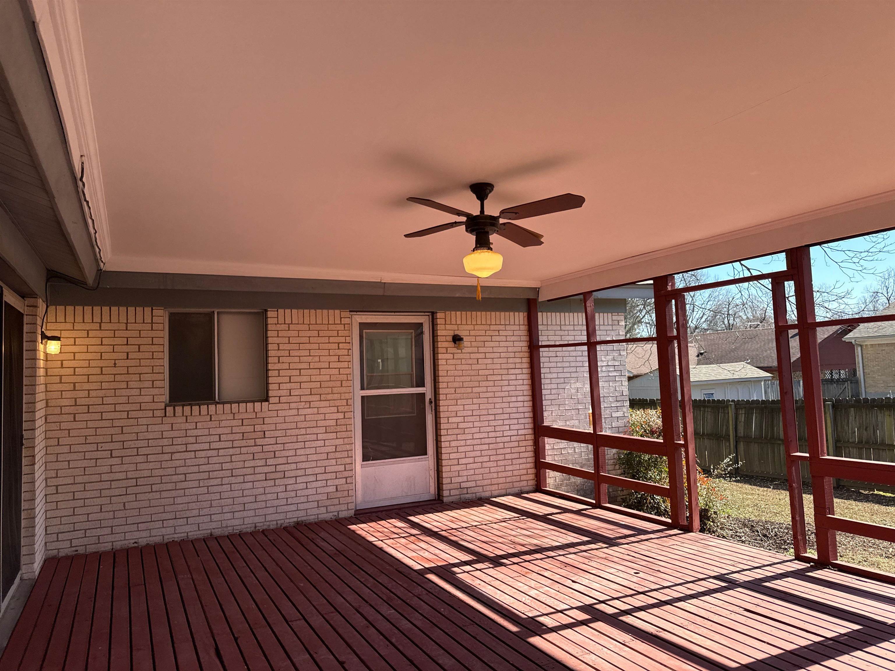 5315 Yale Road Memphis, TN 38134 - Photo 15 of 15 Unfurnished sunroom featuring ceiling fan and a wooden deck