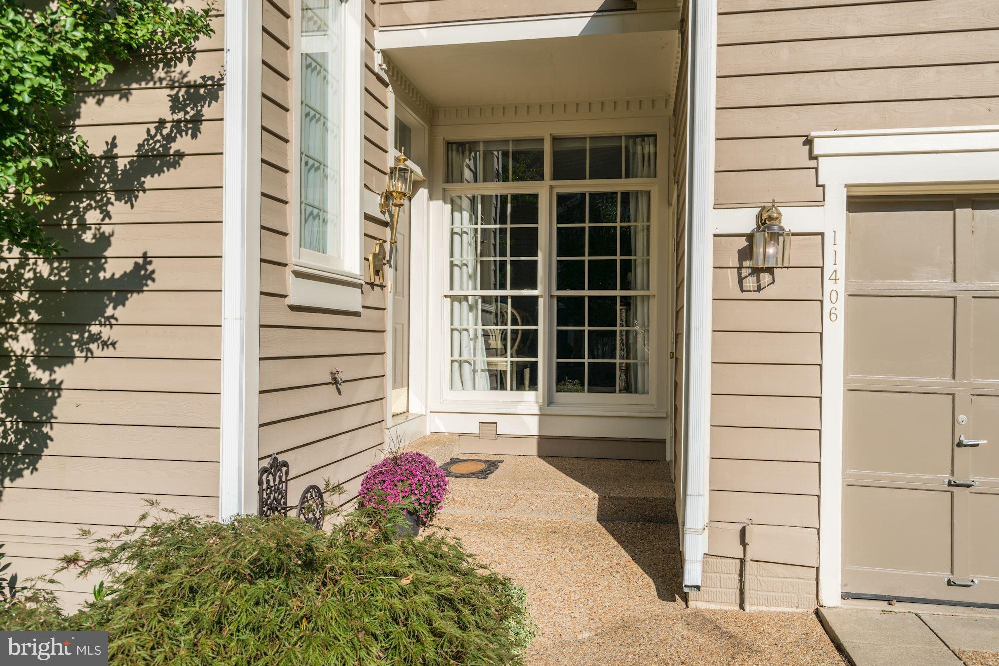 11406 Hollow Timber Way Reston, VA 20194 - Photo 2 of 30 a front view of a building with a window