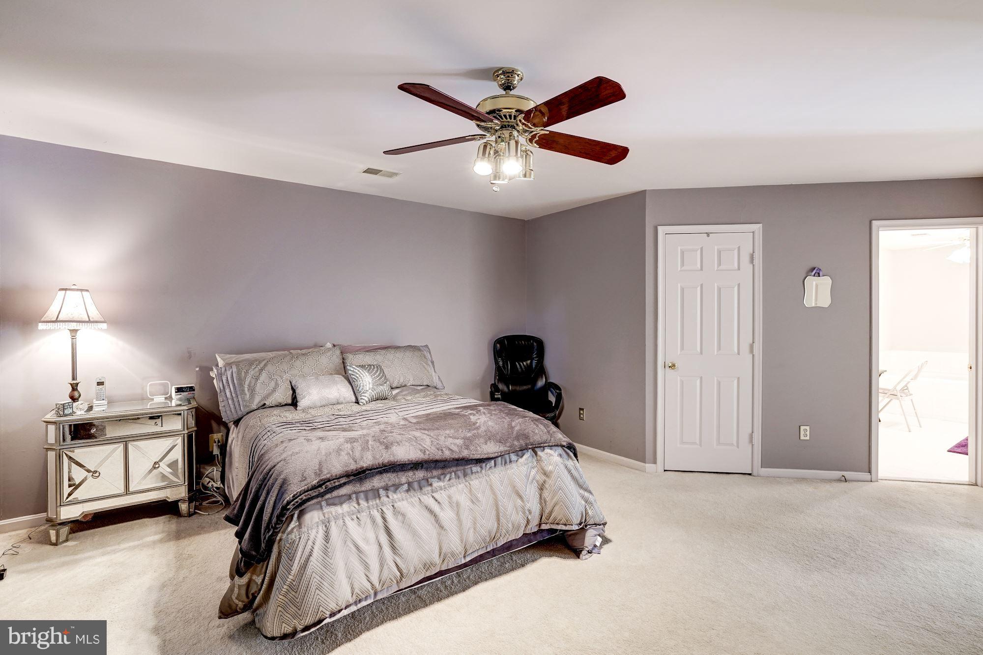 11406 Hollow Timber Way Reston, VA 20194 - Photo 14 of 30 a bedroom with a bed and window