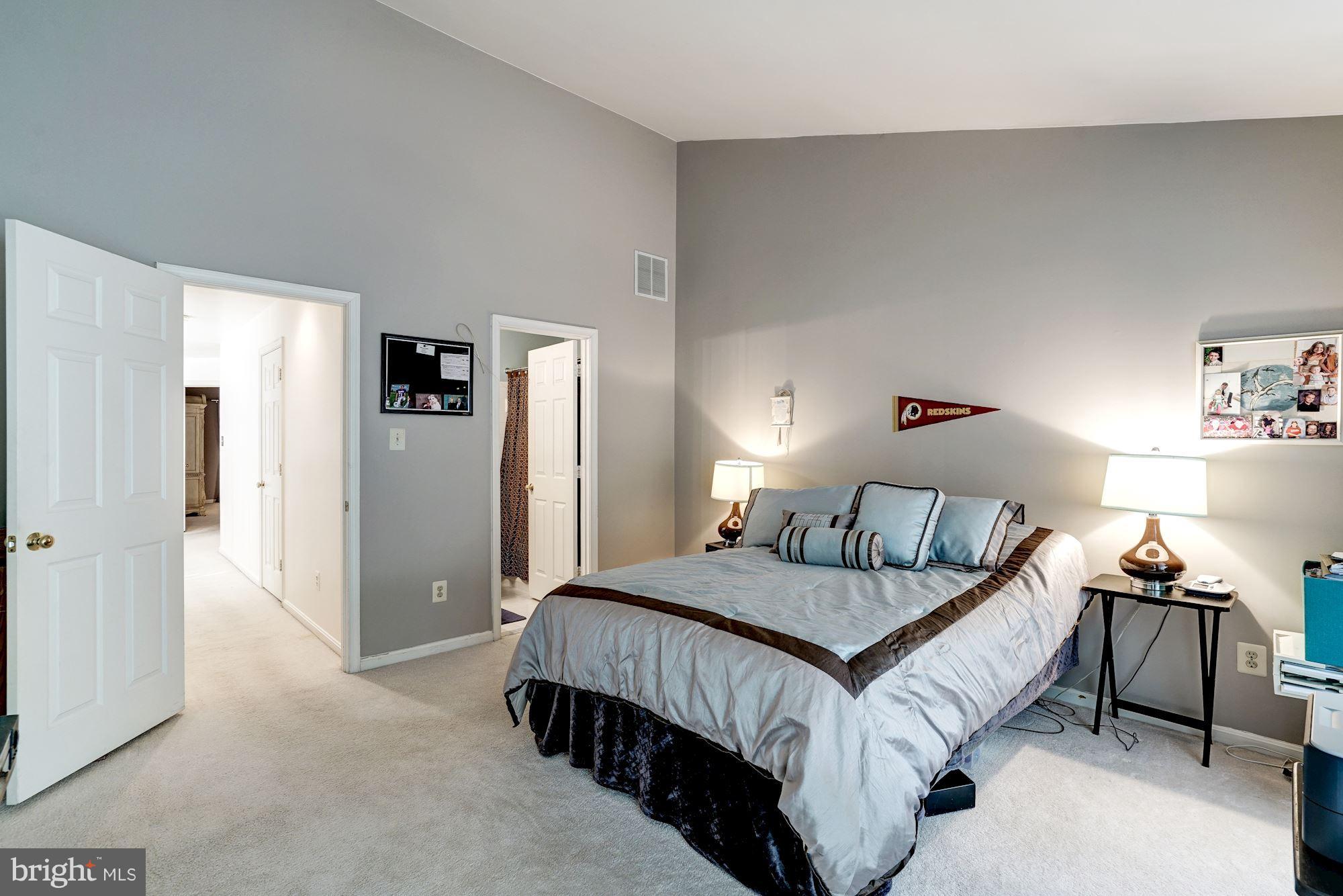 11406 Hollow Timber Way Reston, VA 20194 - Photo 18 of 30 a bedroom with a bed and dresser