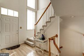 11406 Hollow Timber Way Reston, VA 20194 - Photo 3 of 30 a view of entryway and hall with wooden floor