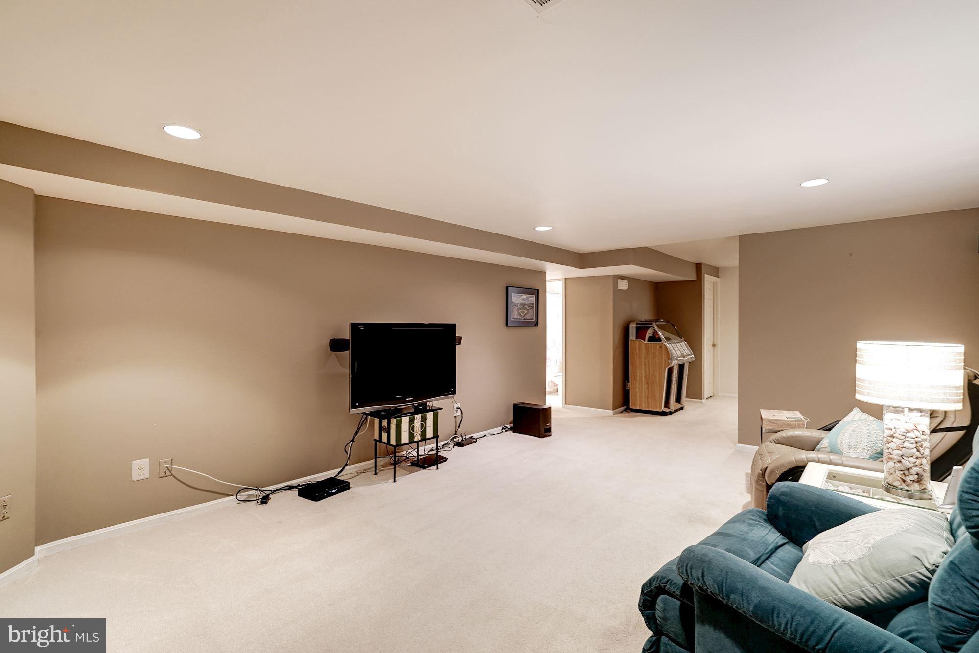 11406 Hollow Timber Way Reston, VA 20194 - Photo 21 of 30 a living room with furniture and a flat screen tv