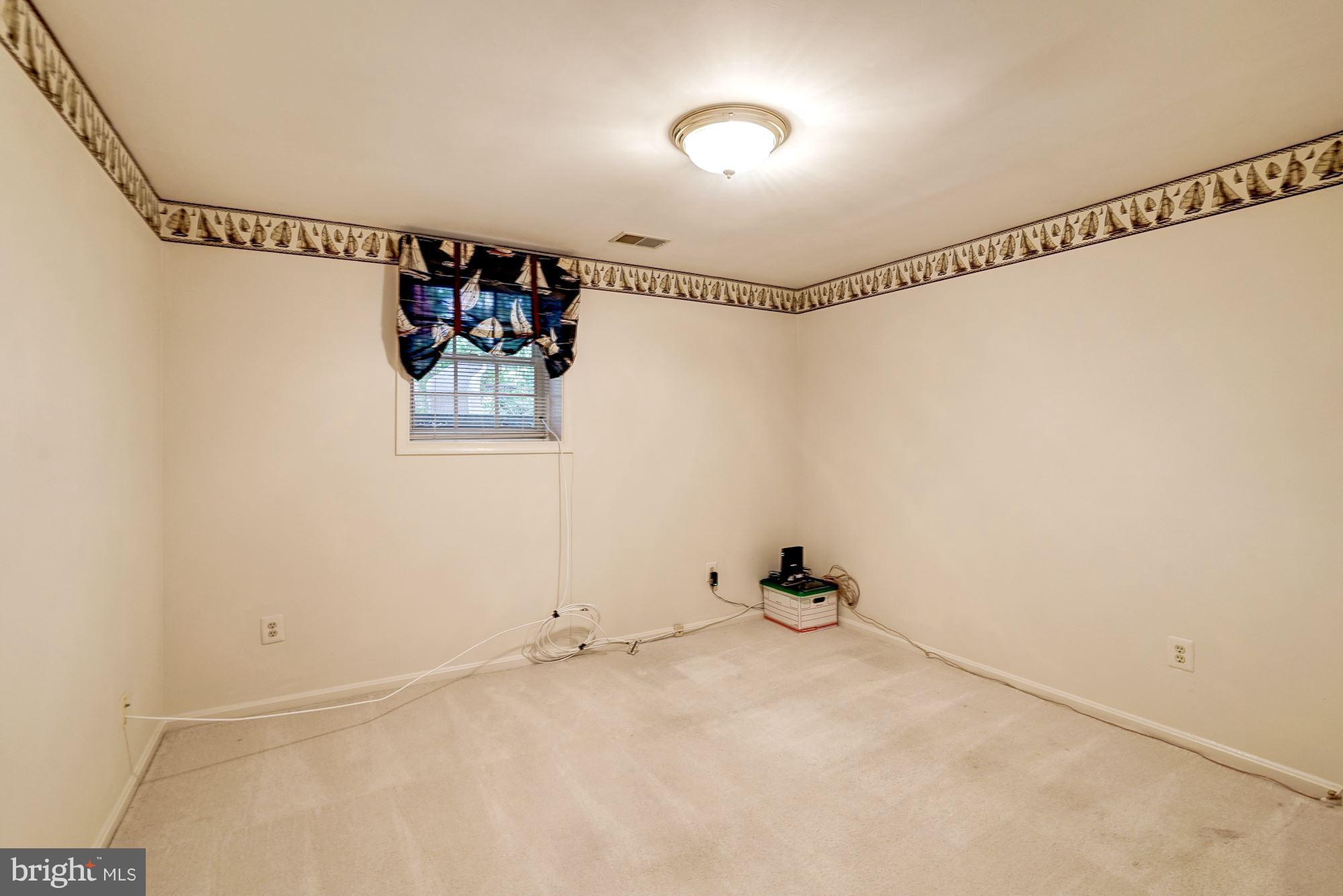 11406 Hollow Timber Way Reston, VA 20194 - Photo 22 of 30 a view of a room with racks on the wall