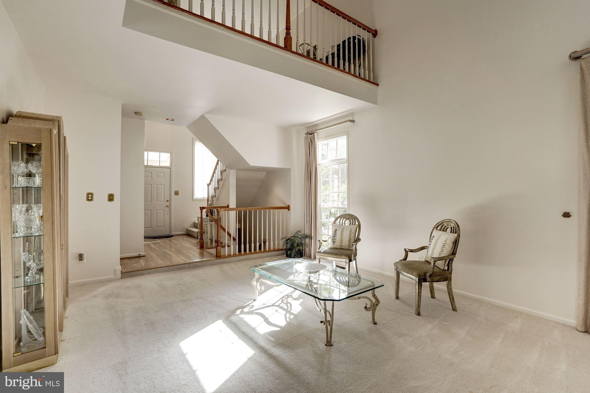 11406 Hollow Timber Way Reston, VA 20194 - Photo 5 of 30 a view of dining room and hall with furniture