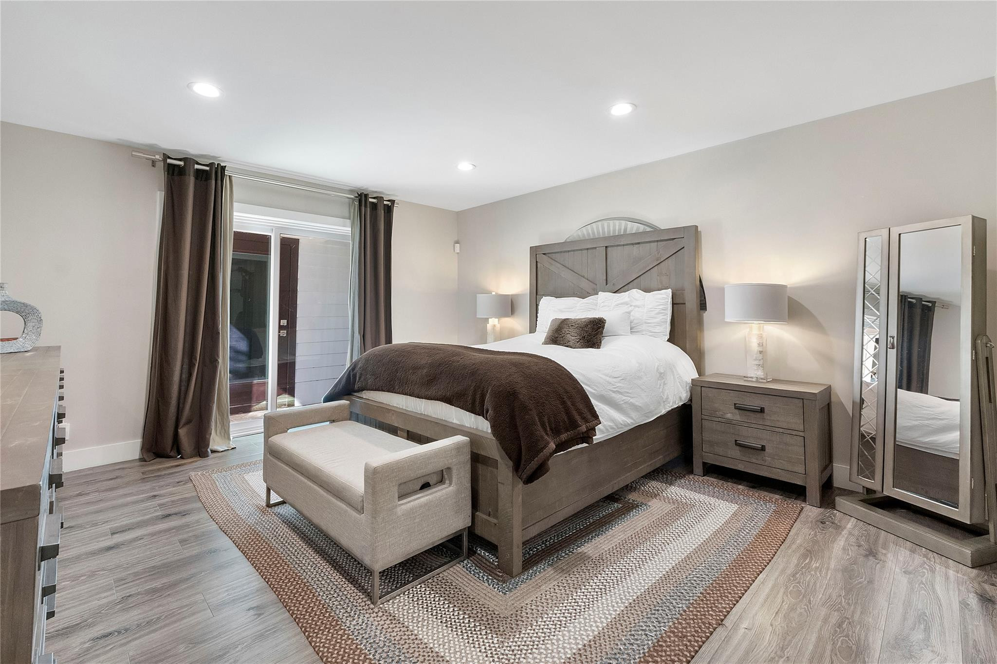 5351 Godfrey Road Parkland, FL 33067 - Photo 20 of 95 a spacious bedroom with a bed and a large window