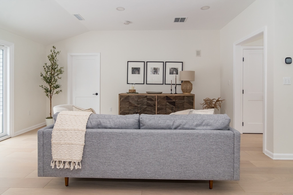 100 Oxbow Road Wayland, MA 01778 - Photo 4 of 17 a living room with furniture and a potted plant
