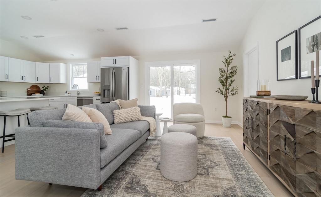 100 Oxbow Road Wayland, MA 01778 - Photo 5 of 17 a living room with furniture and a fireplace
