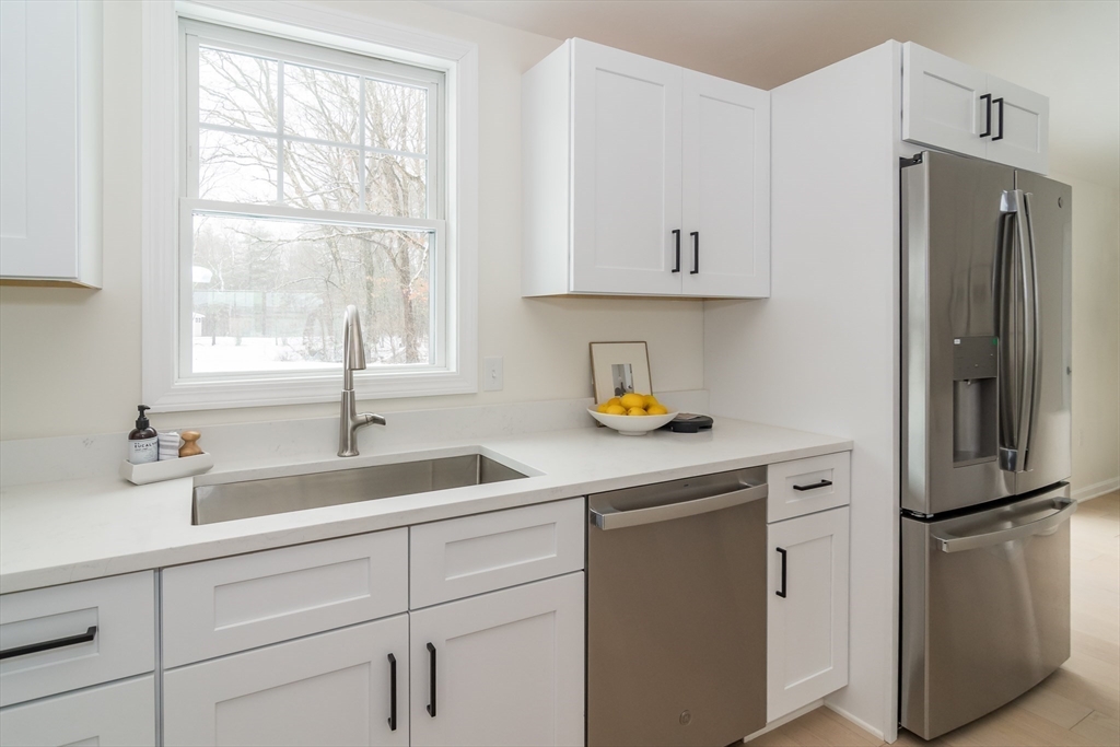 100 Oxbow Road Wayland, MA 01778 - Photo 8 of 17 a kitchen with a refrigerator and a sink