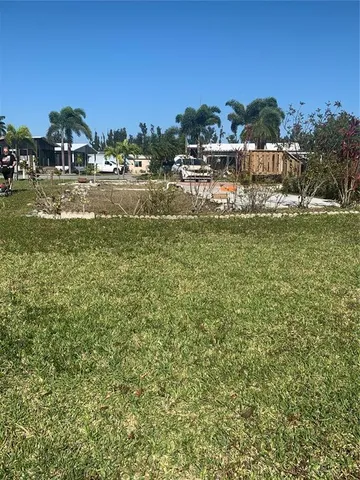 a view of a houses with a yard and lake view