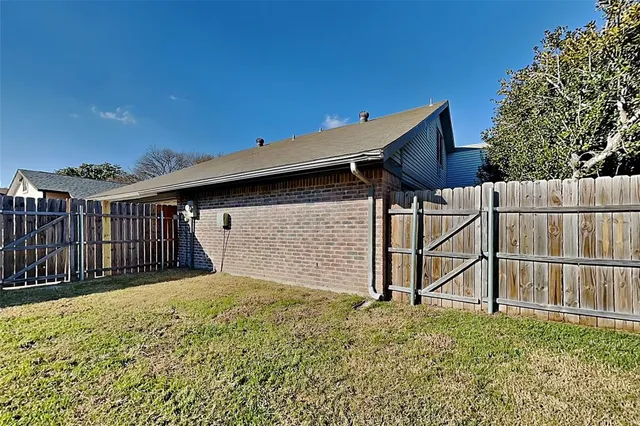 a view of backyard with small cabin