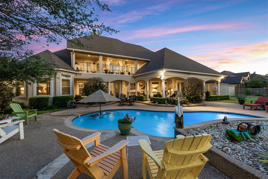 1021 Park Ridge Circle McGregor, TX 76657 - Photo 3 of 48 a view of house with swimming pool yard and outdoor seating