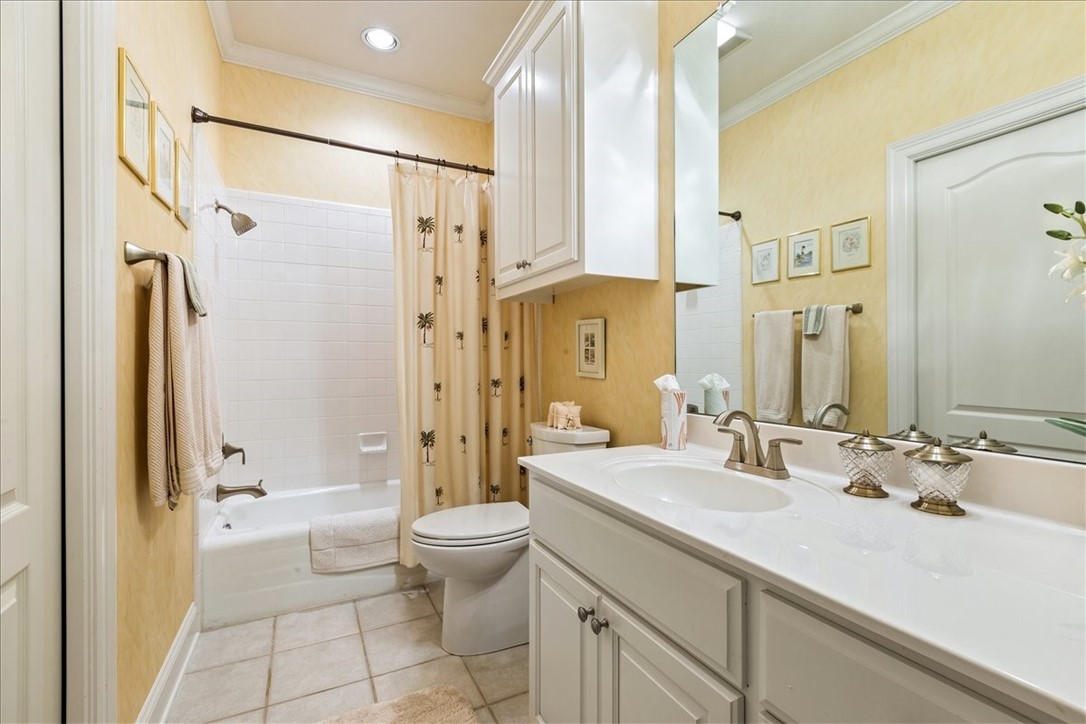 1021 Park Ridge Circle McGregor, TX 76657 - Photo 33 of 48 a bathroom with a double vanity sink toilet mirror and shower