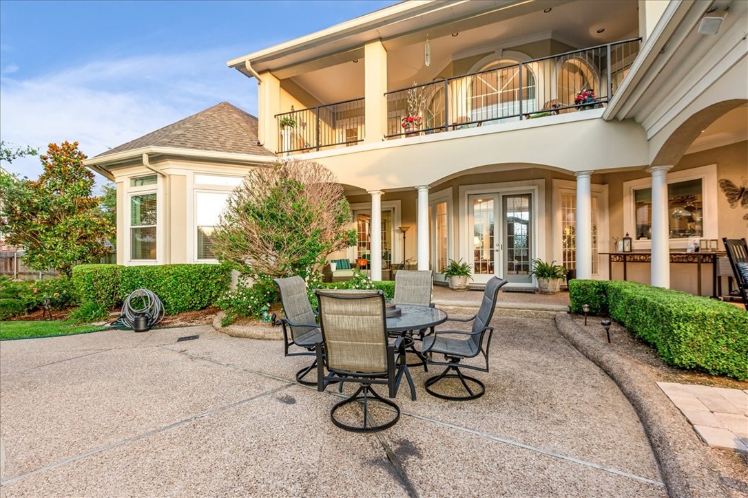 1021 Park Ridge Circle McGregor, TX 76657 - Photo 40 of 48 a view of a patio with table and chairs and potted plants