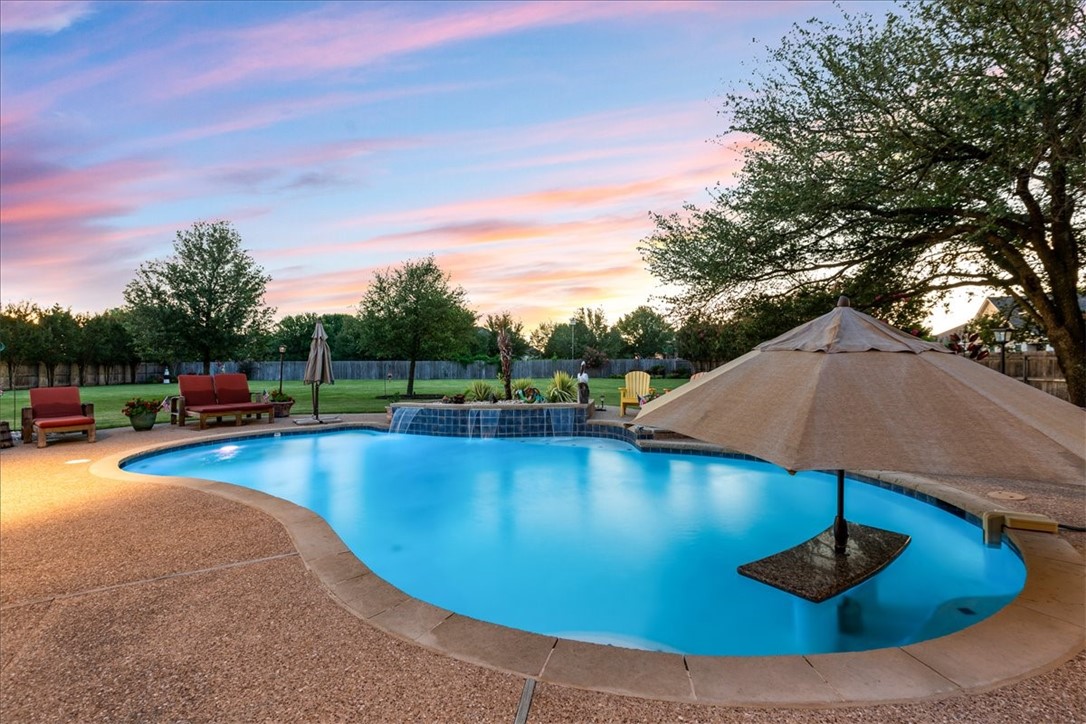 1021 Park Ridge Circle McGregor, TX 76657 - Photo 42 of 48 a view of a swimming pool with a yard