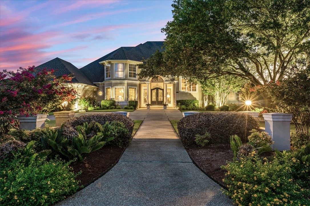 1021 Park Ridge Circle McGregor, TX 76657 - Photo 45 of 48 a front view of a house with a yard and potted plants