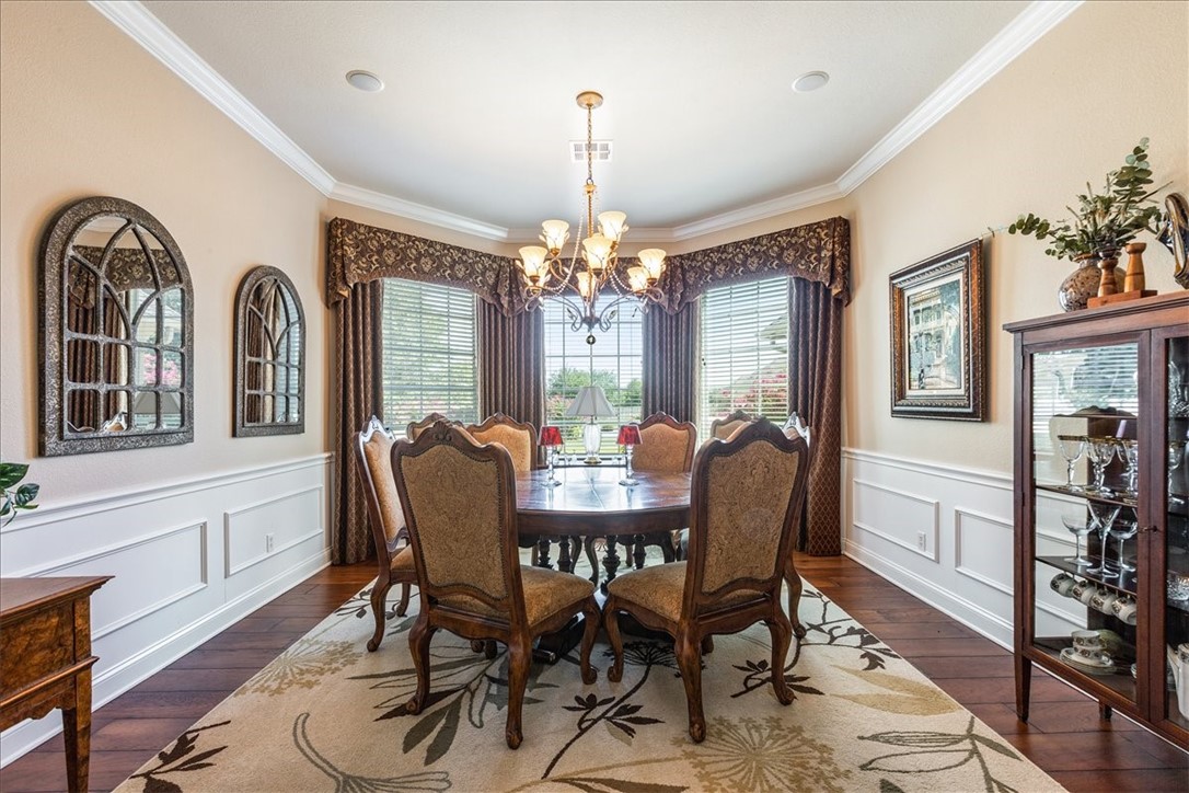 1021 Park Ridge Circle McGregor, TX 76657 - Photo 8 of 48 a view of a dining room with furniture window and wooden floor