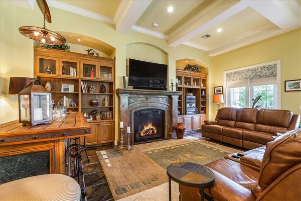 a kitchen with stainless steel appliances granite countertop a sink a stove and a refrigerator