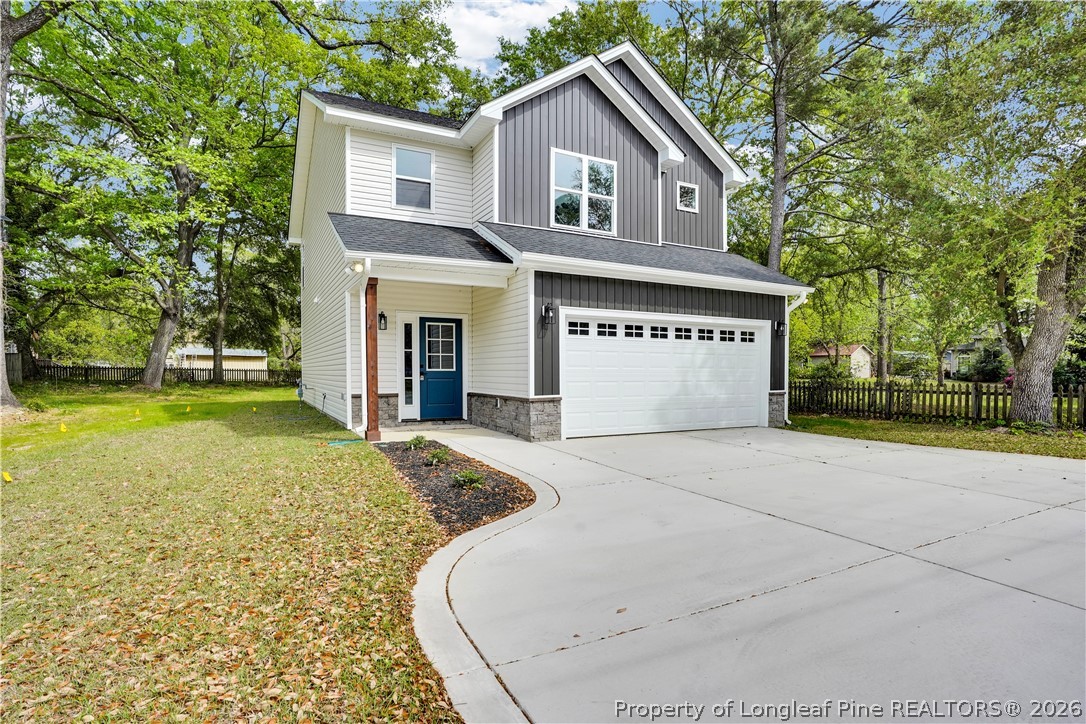 610 North Main Street Raeford, NC 28376 - Photo 2 of 28 a front view of a house with a yard and garage