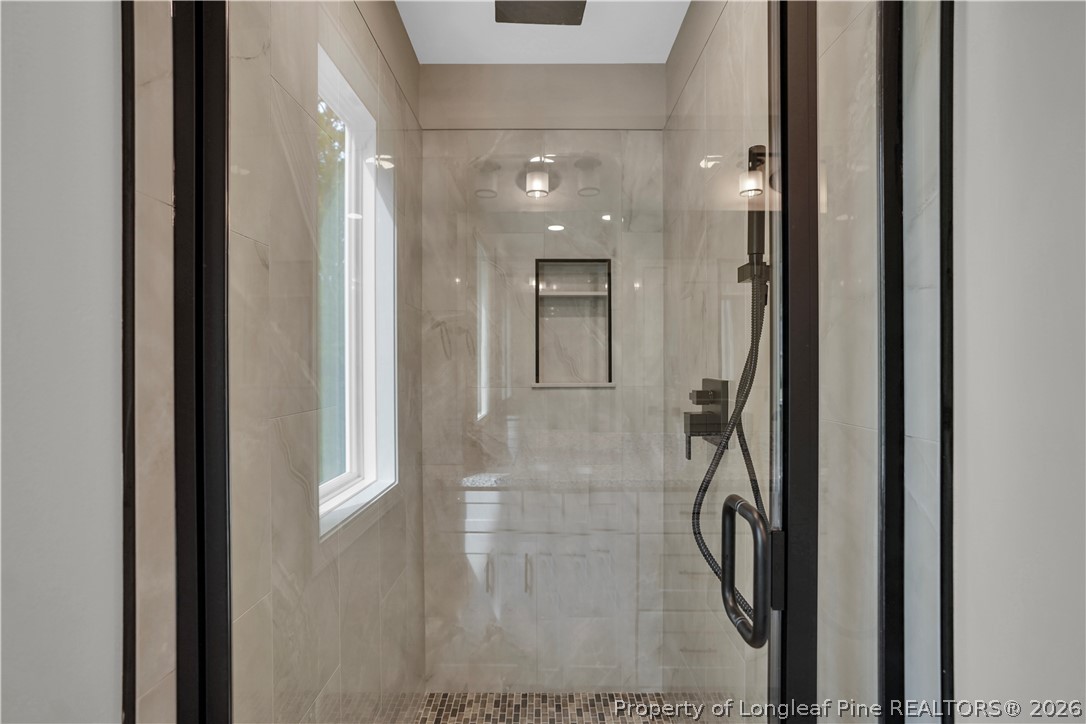 610 North Main Street Raeford, NC 28376 - Photo 23 of 28 a bathroom with a glass shower door