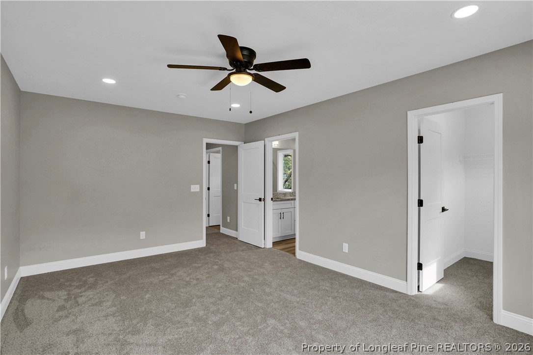 610 North Main Street Raeford, NC 28376 - Photo 24 of 28 a view of a livingroom with a ceiling fan & windows