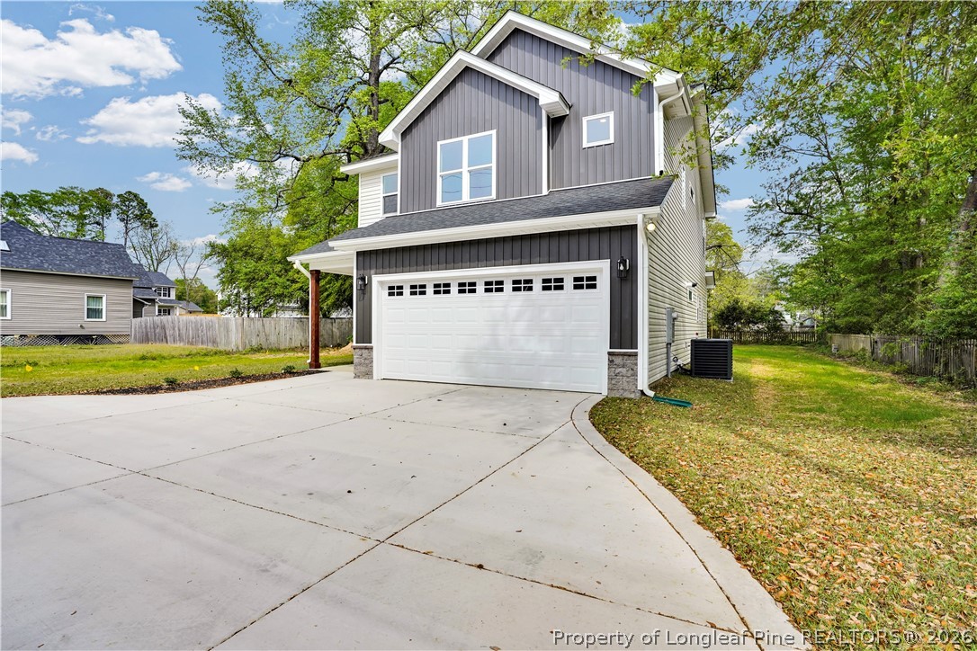 610 North Main Street Raeford, NC 28376 - Photo 3 of 28 a front view of a house with a yard and garage