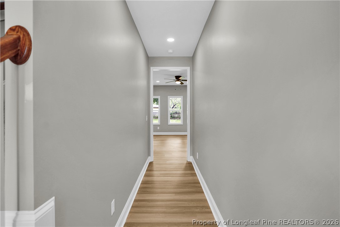 610 North Main Street Raeford, NC 28376 - Photo 5 of 28 a view of a hallway with wooden floor and staircase