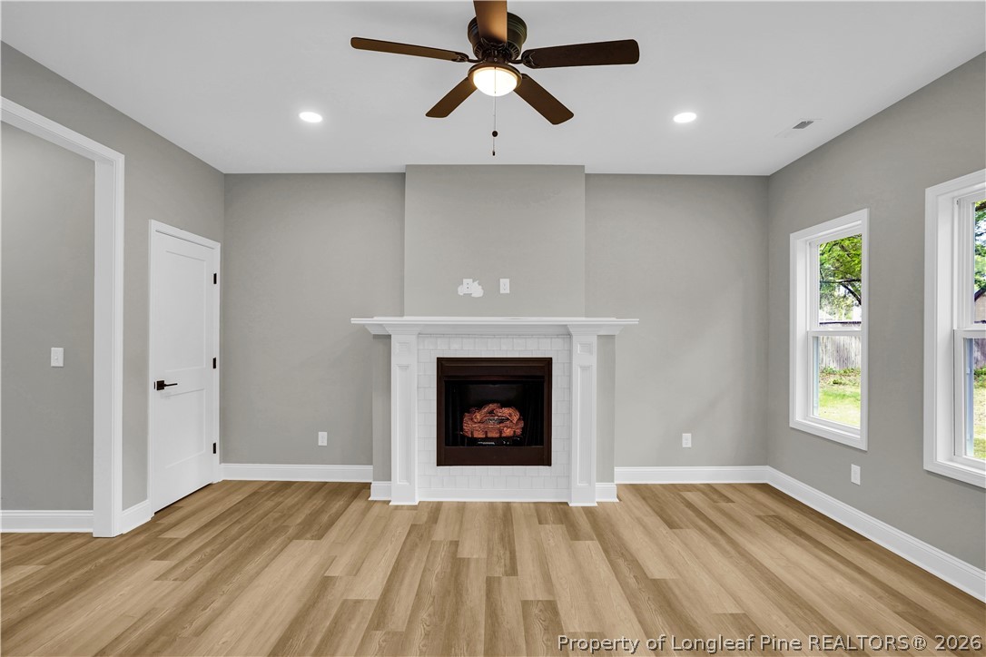 610 North Main Street Raeford, NC 28376 - Photo 8 of 28 a view of an empty room with window and fireplace