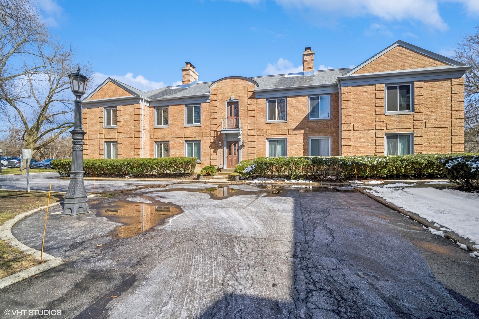 1499 Shermer Road, Unit 201E Northbrook, IL 60062 - Photo 1 of 16 a front view of a house with swimming pool