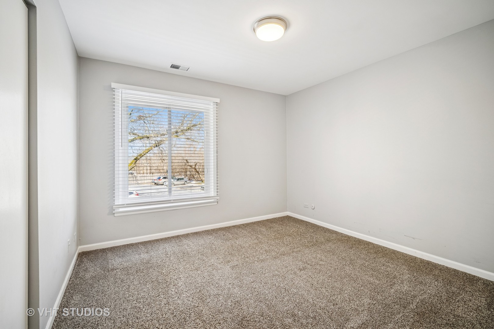 1499 Shermer Road, Unit 201E Northbrook, IL 60062 - Photo 13 of 16 an empty room with a window