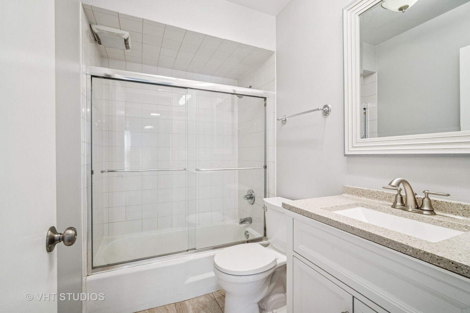 1499 Shermer Road, Unit 201E Northbrook, IL 60062 - Photo 14 of 16 a bathroom with a granite countertop sink toilet and shower
