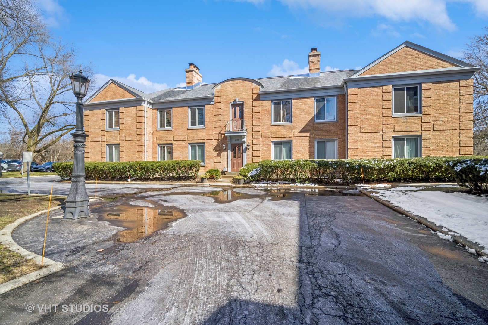 1499 Shermer Road, Unit 201E Northbrook, IL 60062 - Photo 2 of 16 a front view of a house with swimming pool