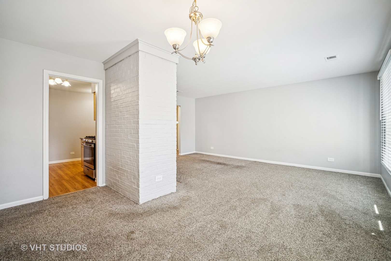 1499 Shermer Road, Unit 201E Northbrook, IL 60062 - Photo 6 of 16 wooden floor in an empty room with a window
