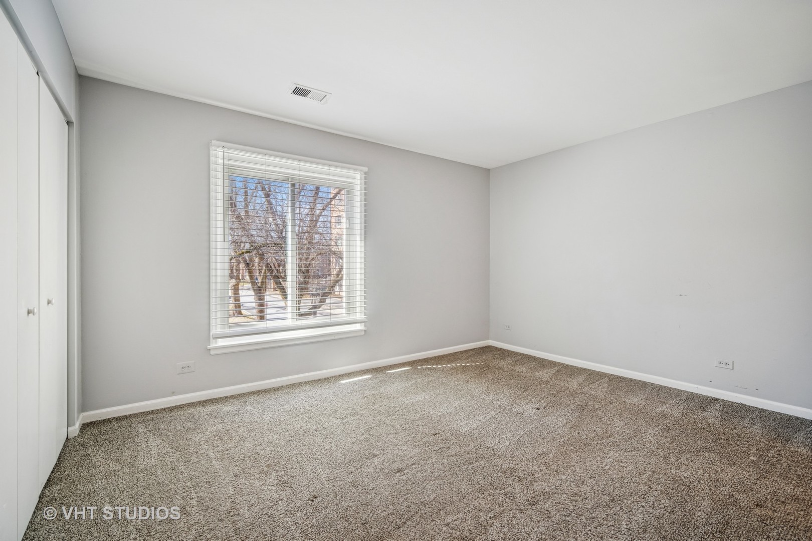 1499 Shermer Road, Unit 201E Northbrook, IL 60062 - Photo 10 of 16 an empty room with a window
