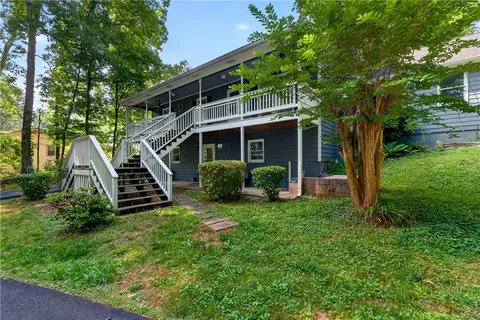 a view of a porch with wooden floor and outdoor space