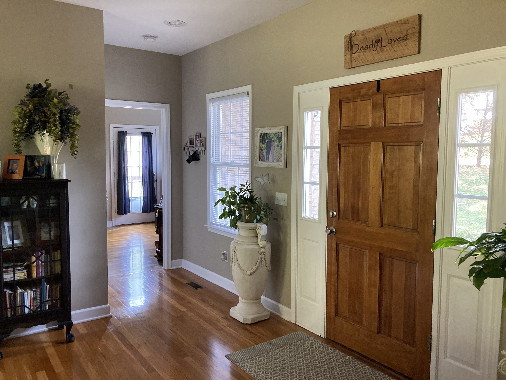 1225 Meeks Cemetery Road Burns, TN 37029 - Photo 12 of 66 a view of a hallway with wooden floor and a living room