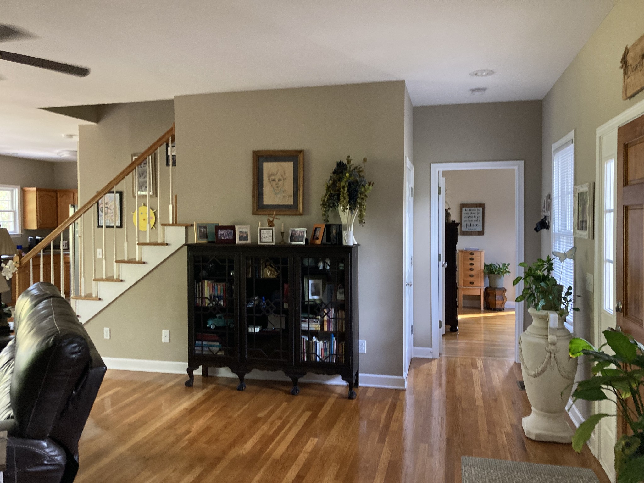 1225 Meeks Cemetery Road Burns, TN 37029 - Photo 15 of 66 a view of a hallway with wooden floor and staircase