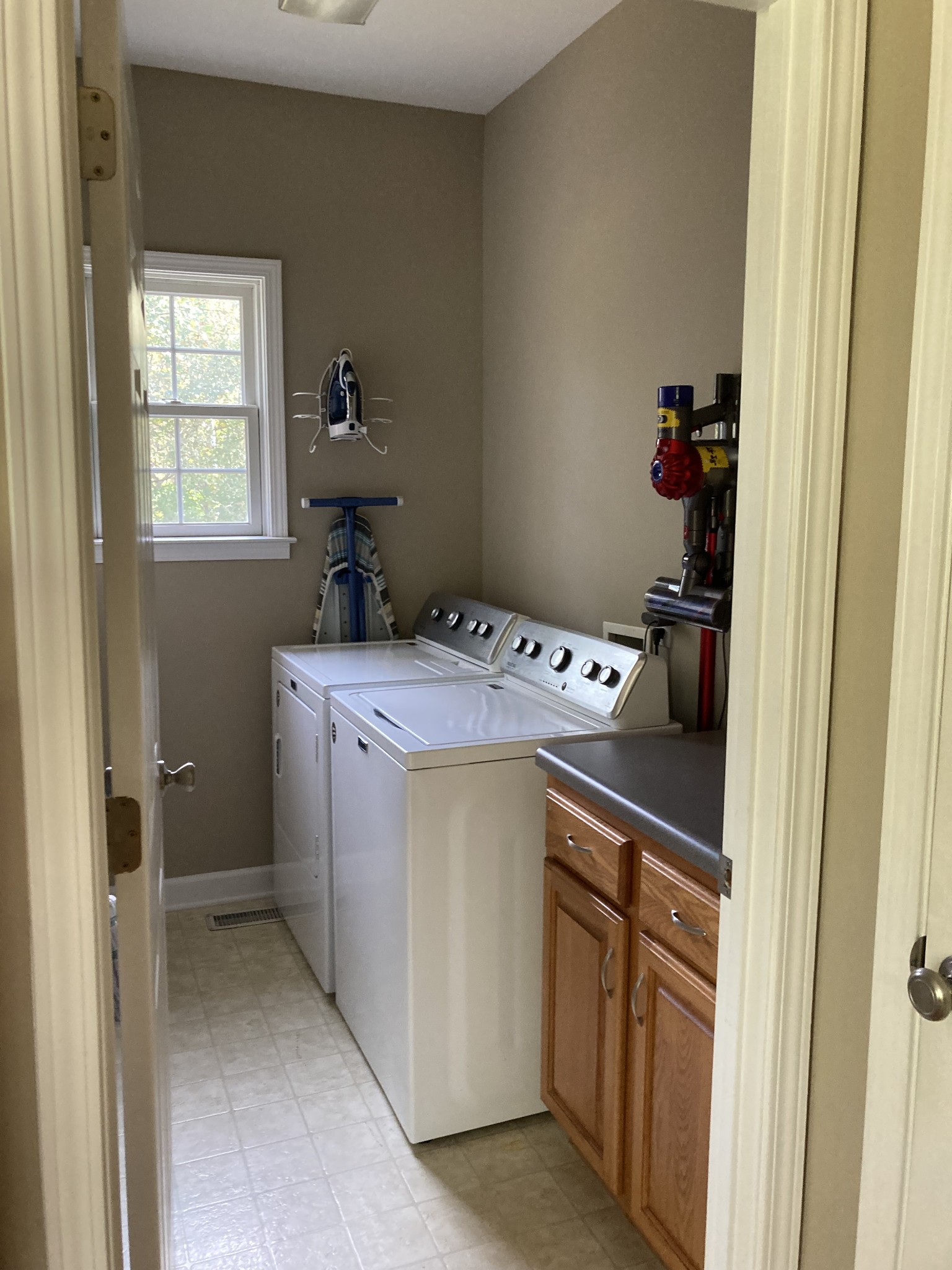 1225 Meeks Cemetery Road Burns, TN 37029 - Photo 19 of 66 a utility room with a sink dryer and washer